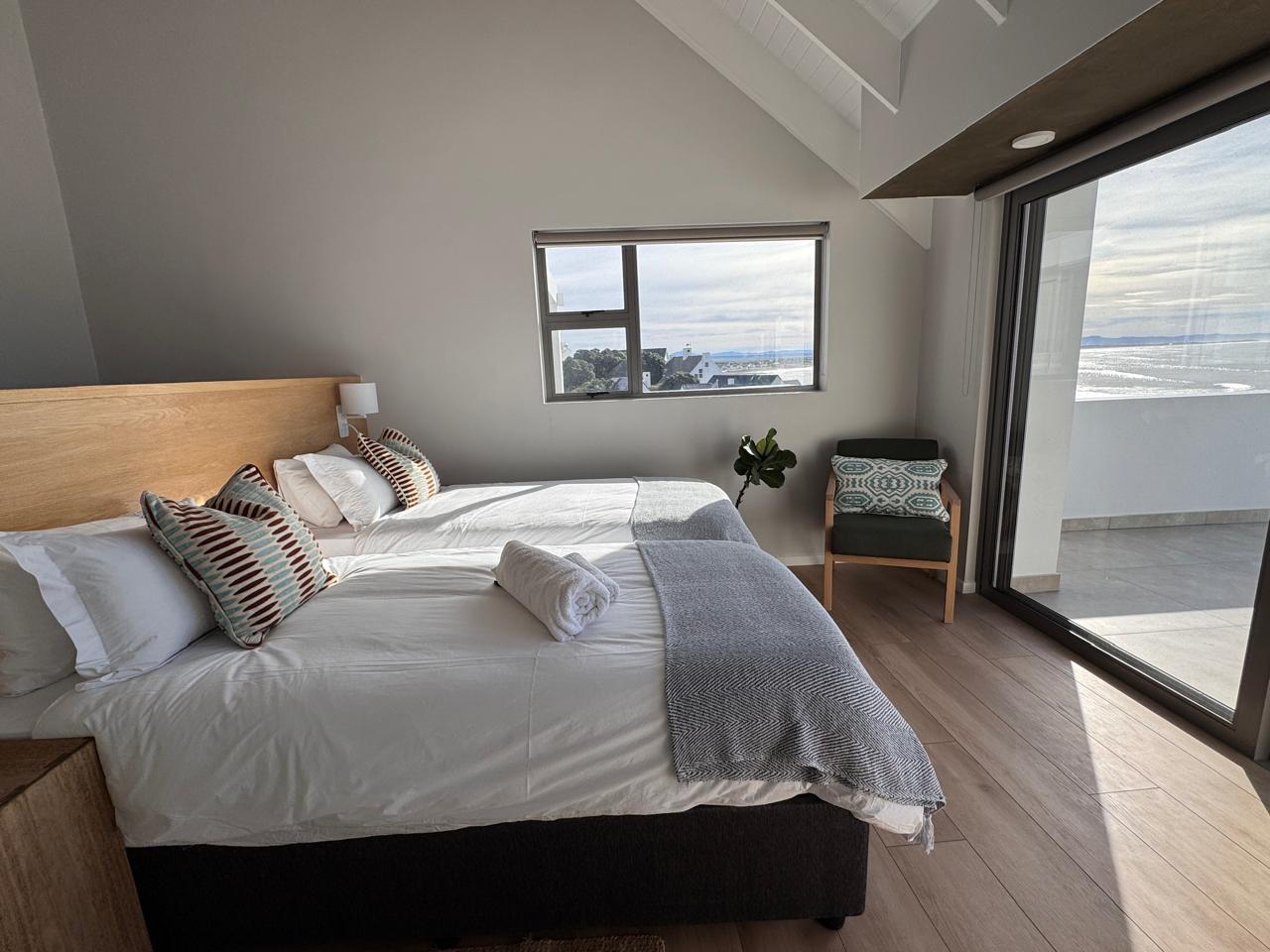 Second bedroom with sea views and balcony access